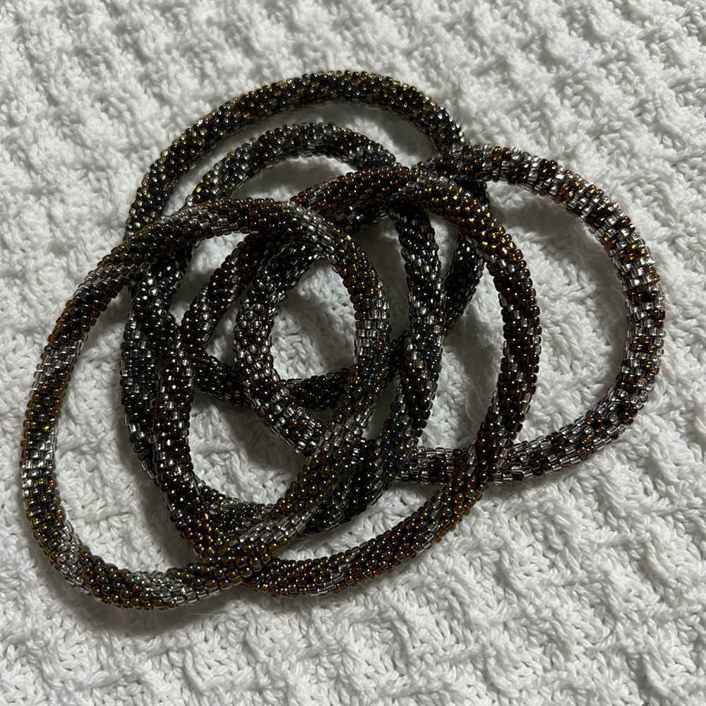 5 Sashka Co handcrafted beaded bracelets. Dark metallic colors. Approx 8”.